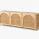 Pavo sideboard with natural wood frame and woven cane front panels