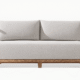 Alexander Sofa by Cozyology Furniture Egypt – minimalist solid wood sofa with light fabric cushions and spindle backrest, suitable for indoor and outdoor use, available in Pitch Pine or zan wood.