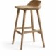 Fexo bar stool in natural wood with sculpted seat and angled legs on white background
