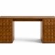 Elto desk in natural wood with geometric carved drawers on white background