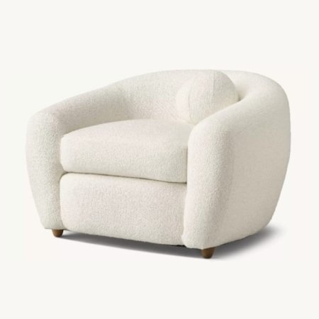Depth lounge chair with deep upholstered seating and rounded sculptural design in a modern interior style