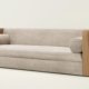 Matter sofa with solid wood side panels and upholstered seating in a modern Japandi interior style