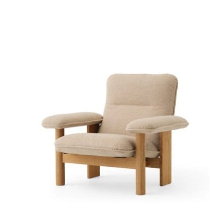 Tala lounge chair with solid wood frame and upholstered seat and arm cushions in a modern interior style