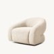 Shell lounge chair with fully upholstered sculptural design in soft fabric for modern minimalist interiors